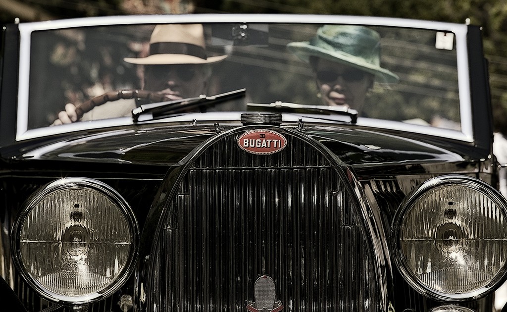 Vintage Bugatti driving in the parade at Villa D’Este Concours Como Italy.