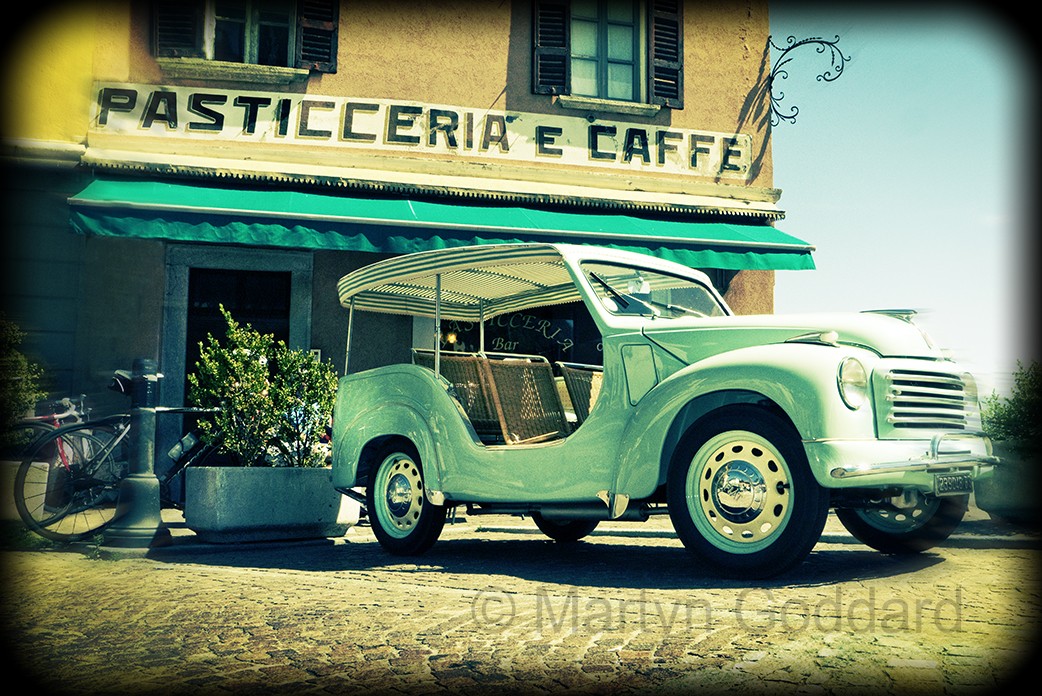Fiat Topolino Jolly parked outside cafe on Lake Como Italy.