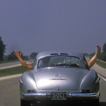 Driving a long roadtrip from coast to coast of the USA in 1950's Gullwing Mercedes. This image taken on a long and boring freeway section to keep the team amused, and the photographer an image to illustrate the flat lands. Cleint: Automobile Magazine. 1986.